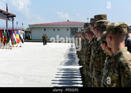 Soldiers with the Ohio National Guard’s 838th Military Police Company and the Tennessee National Guard’s 269th Military Police Company prepare to honor Serbian Armed Forces Col. Slobodan Stopa, 4th Army Brigade commander, with a salute during opening ceremonies for Exercise Platinum Wolf 2018 at South Base, Serbia, June 11, 2018. Nearly 45 members of the 838th MP Company arrived in the Republic of Serbia June 10 to participate in exercise Platinum Wolf. The two-week, multinational peacekeeping exercise will bring 10 nations together to enhance military cooperation and interoperability at Serbi Stock Photo