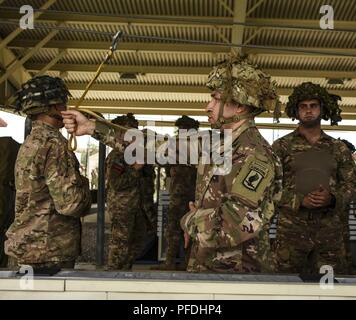 Static Line Jumpmaster Command Screening Checklist A paratrooper holds his static line out toward the jumpmaster as he ...