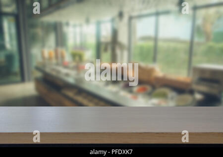 wood top table and Abstract Blurred image food bar at cafe. Can be used for display or montage your products. Stock Photo