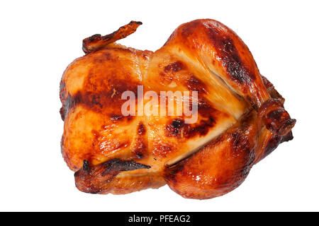 delicious golden crispy skin chicken grilled in oven isolated on white, view from above, close-up Stock Photo