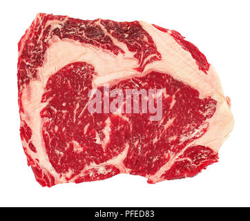 raw beef rib eye steak isolated on white background, view from above, close-up Stock Photo