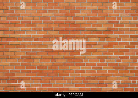 Flemish stretcher bond pattern brick wall background with weathered bricks in orange and yellow colors Stock Photo