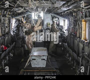 An aerial gunner assigned to the Marine Medium Tiltrotor Squadron 161 ...