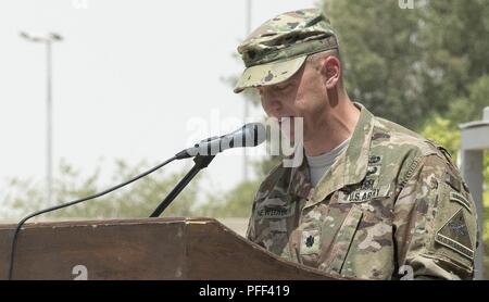 U.S. Army Lt. Col. Rob Newbauer, incoming Commander of the 40th Brigade Engineer Battalion, 2nd Brigade Combat Team, 1st Armored Division, addresses the formation during a change of command ceremony at Kuwait Naval Base, Kuwait, June 14, 2018. Newbauer succeeds Lt. Col. David Noble as the Battalion Commander. Stock Photo