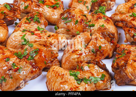 close-up of raw chicken wings marinated with spices and soy sauce accordingly to special recipe, view from above Stock Photo