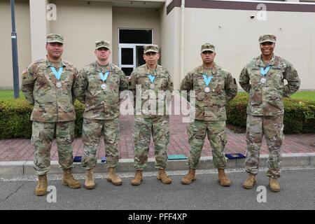 Four Soldiers who were inducted into the Sgt. Audie Murphy Club, receiving an induction award from Maj. Gen. James Pasquarette, commanding general of U.S. Army Japan June 13, 2018 at Camp Zama Community Club during the Army Birthday BBQ are pictured with their outgoing President. From left to right: Staff Sgt. Joel Heredia, U.S. Army Japan Band; Staff Sgt. Michael Jenkins, 35th Combat Sustainment Support Battalion; Sgt. 1st Class Edwin Salazarvaldez, USARJ Headquarters and Headquarters Company, outgoing president of the USARJ Chapter of the SAMC; Staff Sgt. Damien Stowers, 311th Military Intel Stock Photo