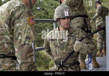 U.S. Army Soldiers rappel out of a UH-60 helicopter on April 20 at Camp ...
