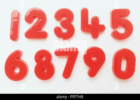 Set of red plastic magnetic numbers in two rows Stock Photo