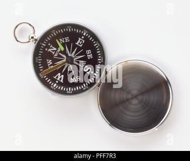 Open pocket compass, close up from above. Stock Photo