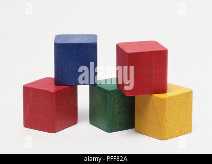 Five coloured wood building blocks. Stock Photo