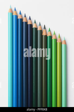 Array of coloured pencils, in shades of blue and green Stock Photo