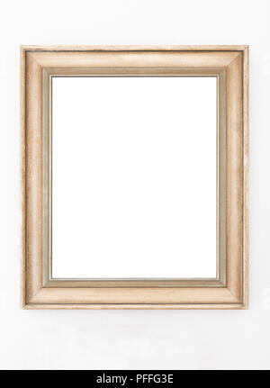 empty ornate picture frame hanging on wall Stock Photo
