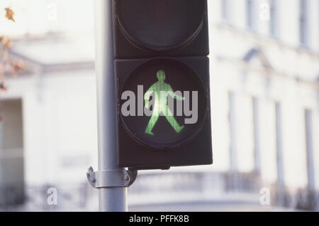 England, London, 'walking man' green light on a pedestrian crossing. Stock Photo