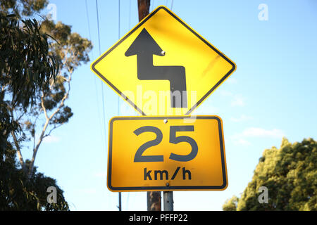 Warning sign, Reverse curve greater than 60 degrees, first to left and 25kms/hour advisory speed road sign, Vanessa Street, Kingsgrove, Sydney, NSW, A Stock Photo