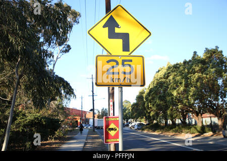 Warning sign, Reverse curve greater than 60 degrees, first to left and 25kms/hour advisory speed road sign, Vanessa Street, Kingsgrove, Sydney, NSW, A Stock Photo