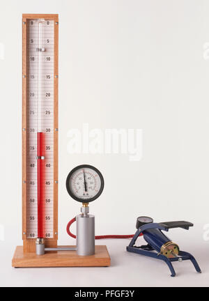 Apparatus to measure pressure with foot pump showing Boyle's Law, the volume of mass of gas at a fixed temperature will change in relation to the pressure. Stock Photo