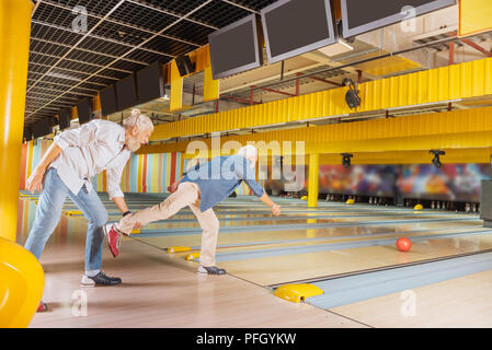 Nice positive elderly men having fun at day Stock Photo