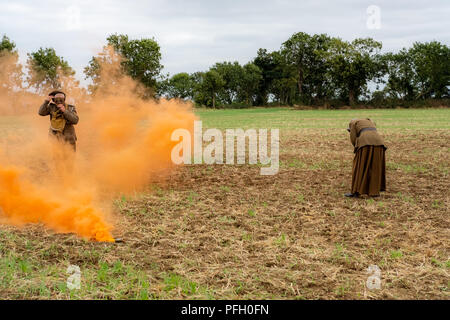 WW1 battle scene depicting a mustard gas attack on British troops, depicted by the orange smoke. Stock Photo