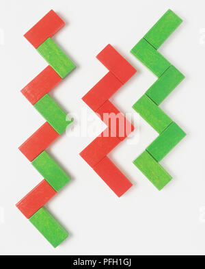 Three rows of rectangular wooden building blocks arranged in zigzag patterns Stock Photo