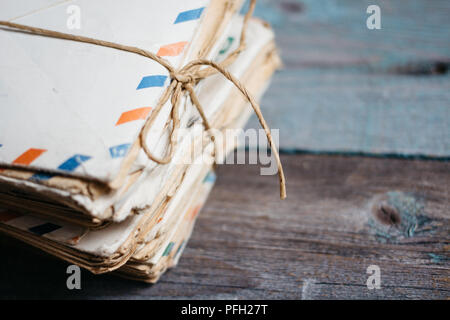Stack of vintage letters on wooden table Stock Photo