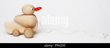 wooden toy duck on wheels