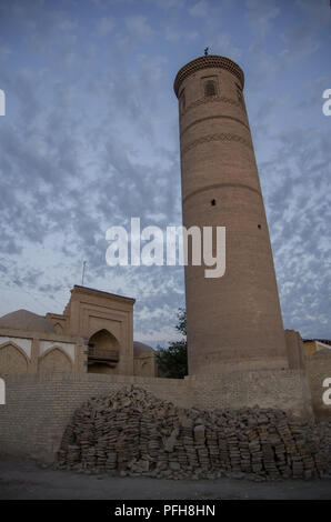 Minaret of Palvan Kari madrasa, Khiva, Uzbekistan Stock Photo