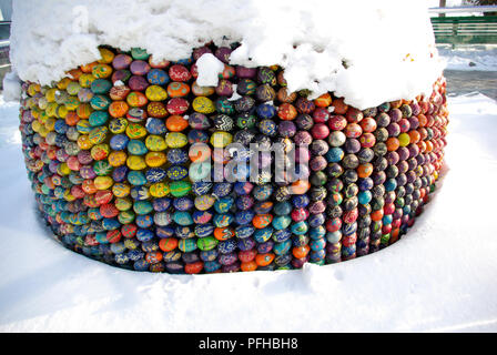Easter eggs forming a shape on snow Stock Photo