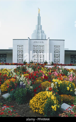 USA, Idaho Falls, Mormon temple with colourful flower gardens in front, front view Stock Photo