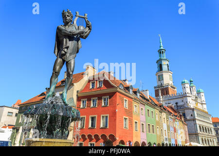 POznan - Fountain with statue of Apollo in old town square. In background historic tenement houses and town hall Stock Photo