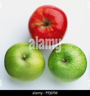 Three apples, one red, two green Stock Photo