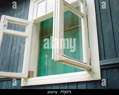 mosquito net on a wide open window, outdoor angled shot Stock Photo