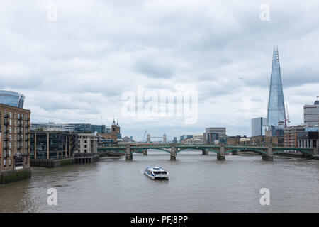 View along River Thames from Millennium Bridge looking East towards The Shard building