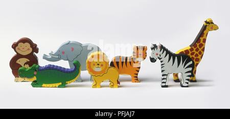 Wooden toy animals, including monkey, crocodile, elephant, lion, tiger, zebra, giraffe Stock Photo