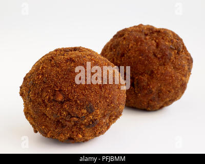 Two Scotch eggs coated in breadcrumbs, close-up Stock Photo