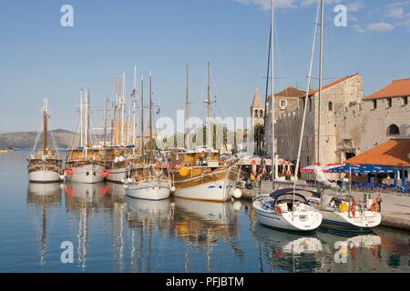 Croatia, Trogir, Riva, sailing boats moored on waterfront on Dalmatian coastline Stock Photo