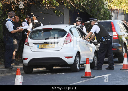 A motorist is pulled over by officers from the Violent Crime Task Force ...