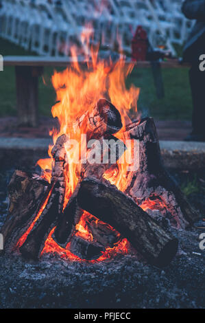 warm bonfire with blue grey background Stock Photo