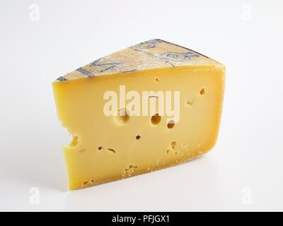 Slice of Italian Formai de Mut dell'Alta Val Brembana PDO cow's milk cheese Stock Photo
