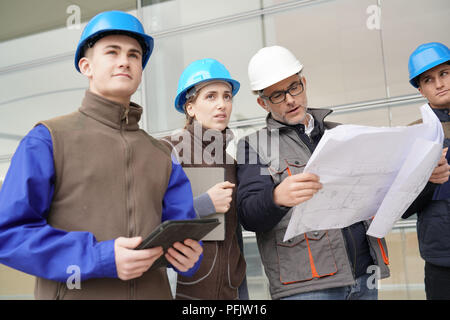 Instructor with young people in engineering training Stock Photo