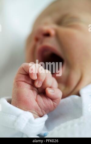 6-day-old baby boy, with mouth wide open, close-up Stock Photo