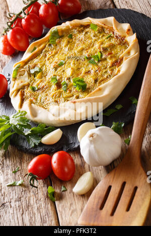 Vegetable potato open pie closeup on the table and ingredients. vertical Stock Photo