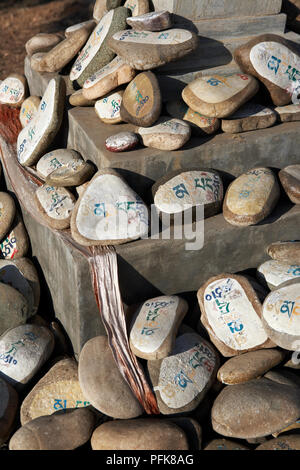 China, Hebei, Chengde, Xumifushou Miao (Temple of Happiness and Longevity), mani stones at base of shrine, close-up Stock Photo