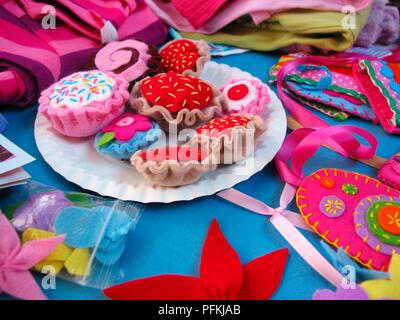 Pretend picnic with colourful cakes made from fabric at the centre, close-up Stock Photo