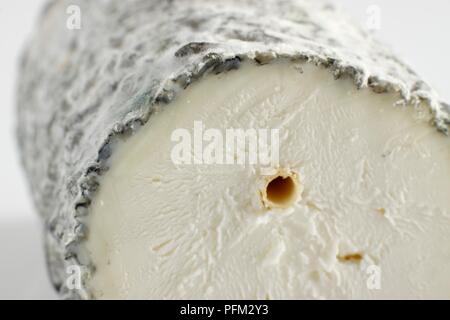 Sliced log of French Sainte-Maure de Touraine goat's cheese Stock Photo