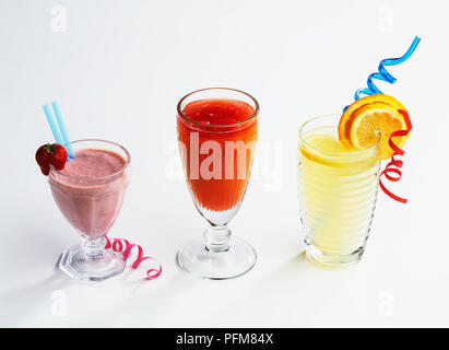 Glasses of lemonade, punch and strawberry milkshake Stock Photo