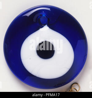 Turkish simple blue glass-eye pendants for warding off 'evil eye'. Stock Photo