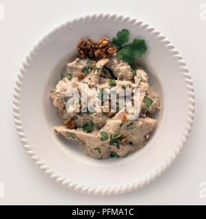 Plate of Cerkez tavugu, Circassian-style chicken in walnut and parsley sauce, view from above Stock Photo
