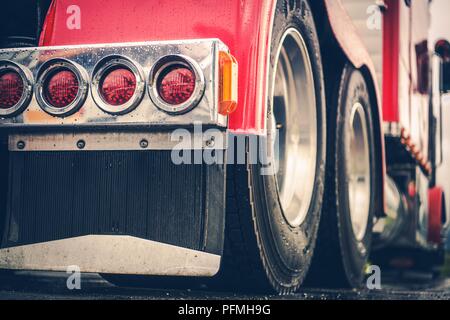 Semi Truck Rear Lights Closeup. American Long Haul Trucking Theme. Stock Photo