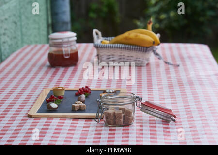 Fresh lemonade mint sugar cubes on red checkered tablecloth Stock Photo