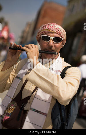 Flute player, Festival of the Chariots, August 5, 2018, (The Hare Krishna Festival), Venice Beach, Los Angeles, California, USA Stock Photo